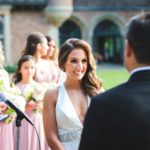 Bride looks at Groom during wedding ceremony at Meadow Brook Hall
