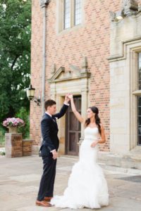 Bride and Groom dance outside Meadow Brook Hall.