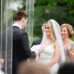 Bride and Groom exchange vows in wedding ceremony at Meadow Brook Hall