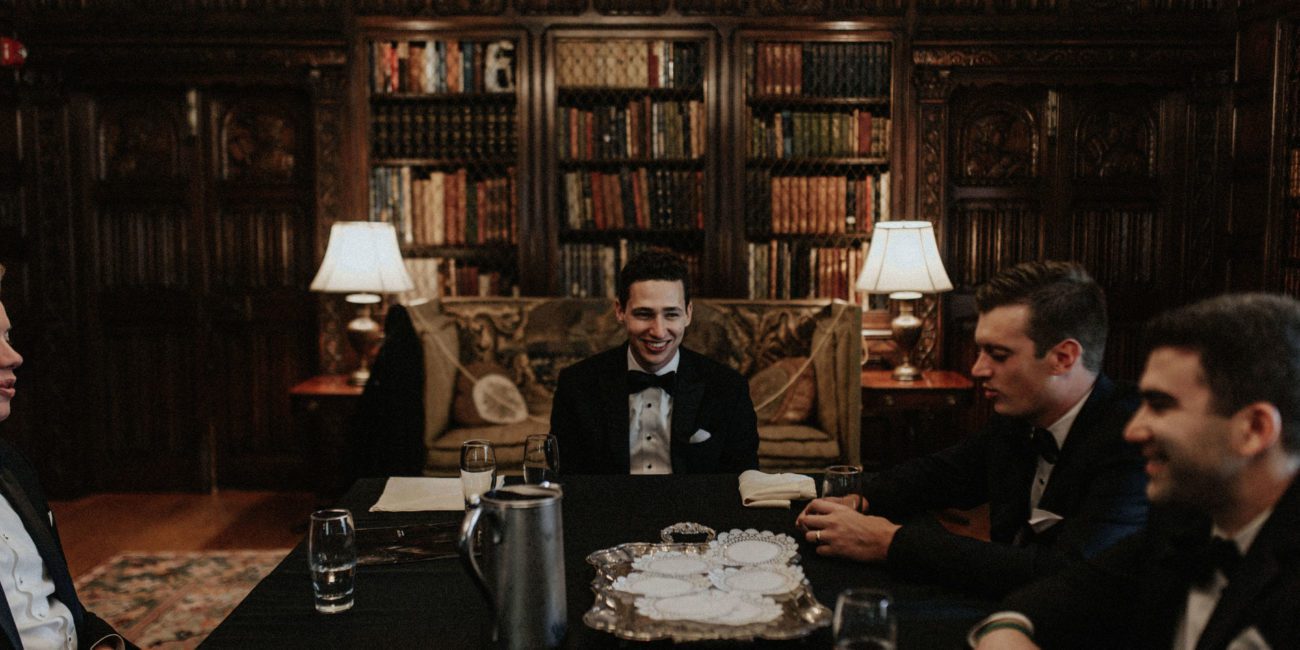 Groom and groomsmen in the library at Meadow Brook Hall
