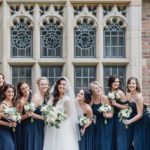 Bride and bridesmaids pose in front of windows at Meadow Brook Hall