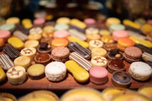 Display of macaroons and small dessert treats.