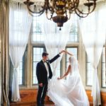 Bride and Groom spin in the windows at Meadow Brook