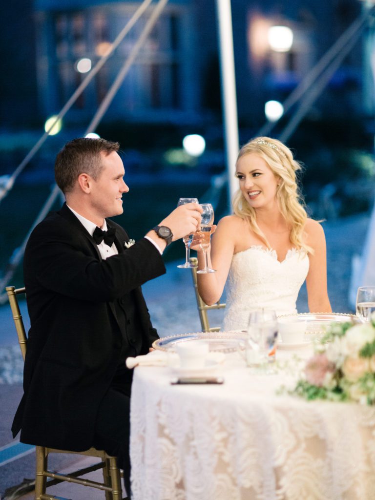 Couple cheers at their wedding reception