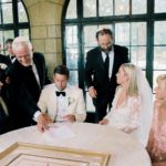 A couple signs their Ketubah at Meadow Brook Hall.