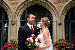 Bride and groom smile at each other at Meadow Brook wedding
