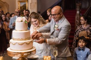Bride and Groom cut their wedding cake at Meadow Brook Hall