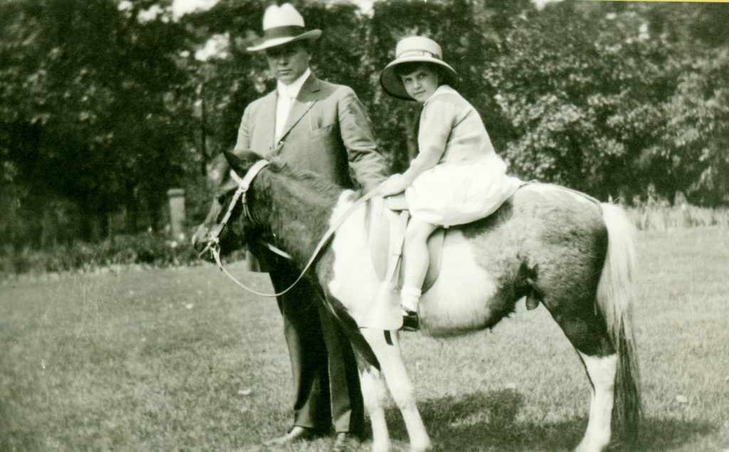Frances Dodge riding a pony