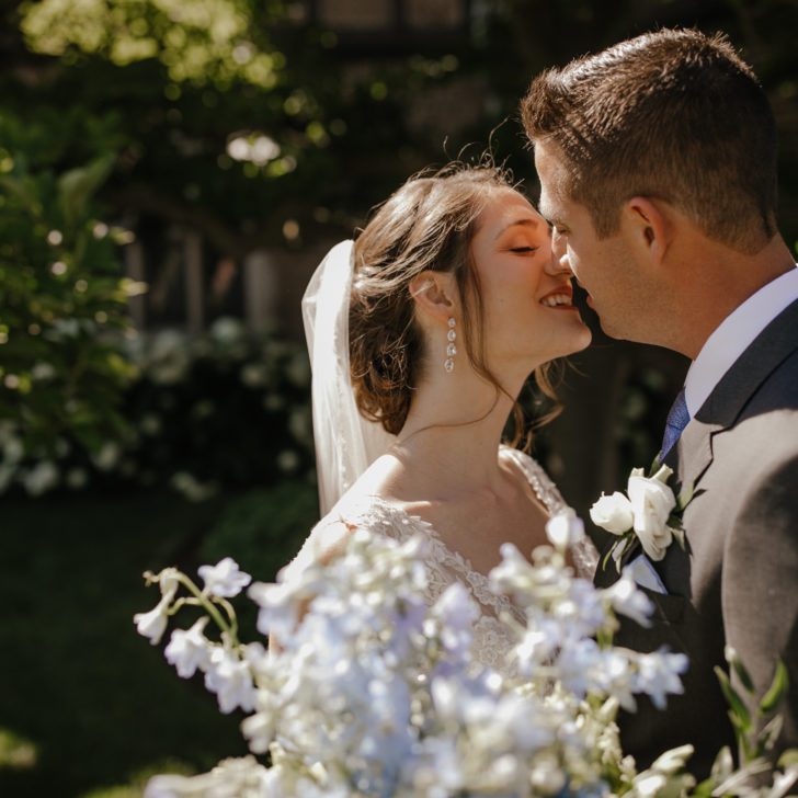 Bride and groom kiss at Meadow Brook Hall