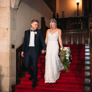 Bride and groom on the Grand Staircase at Meadow Brook on their wedding day