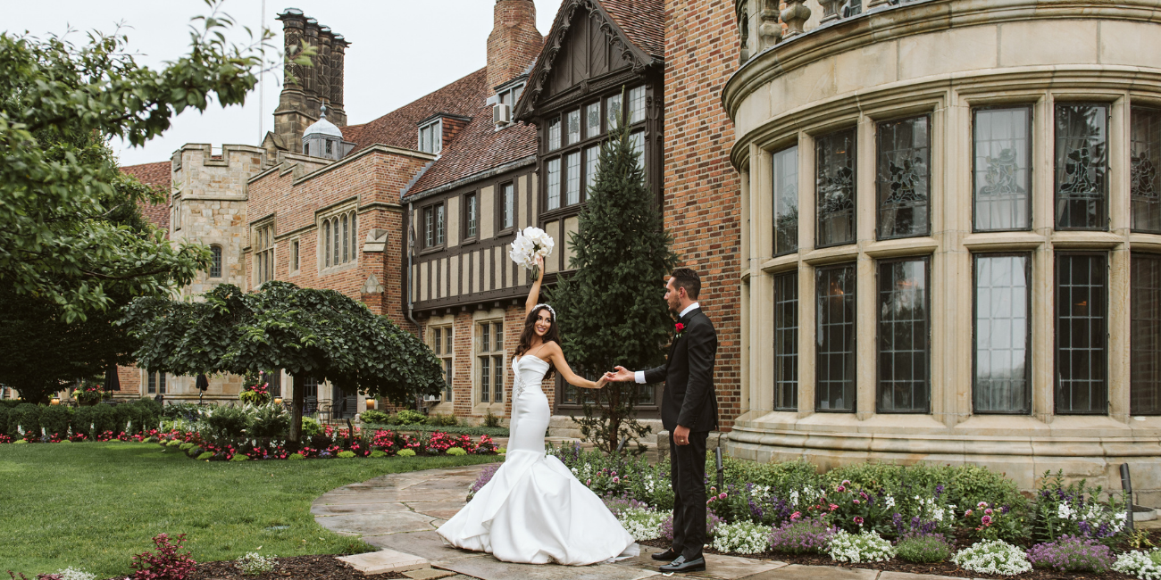 Bride and Groom celebrate at Meadow Brook Hall on their wedding day