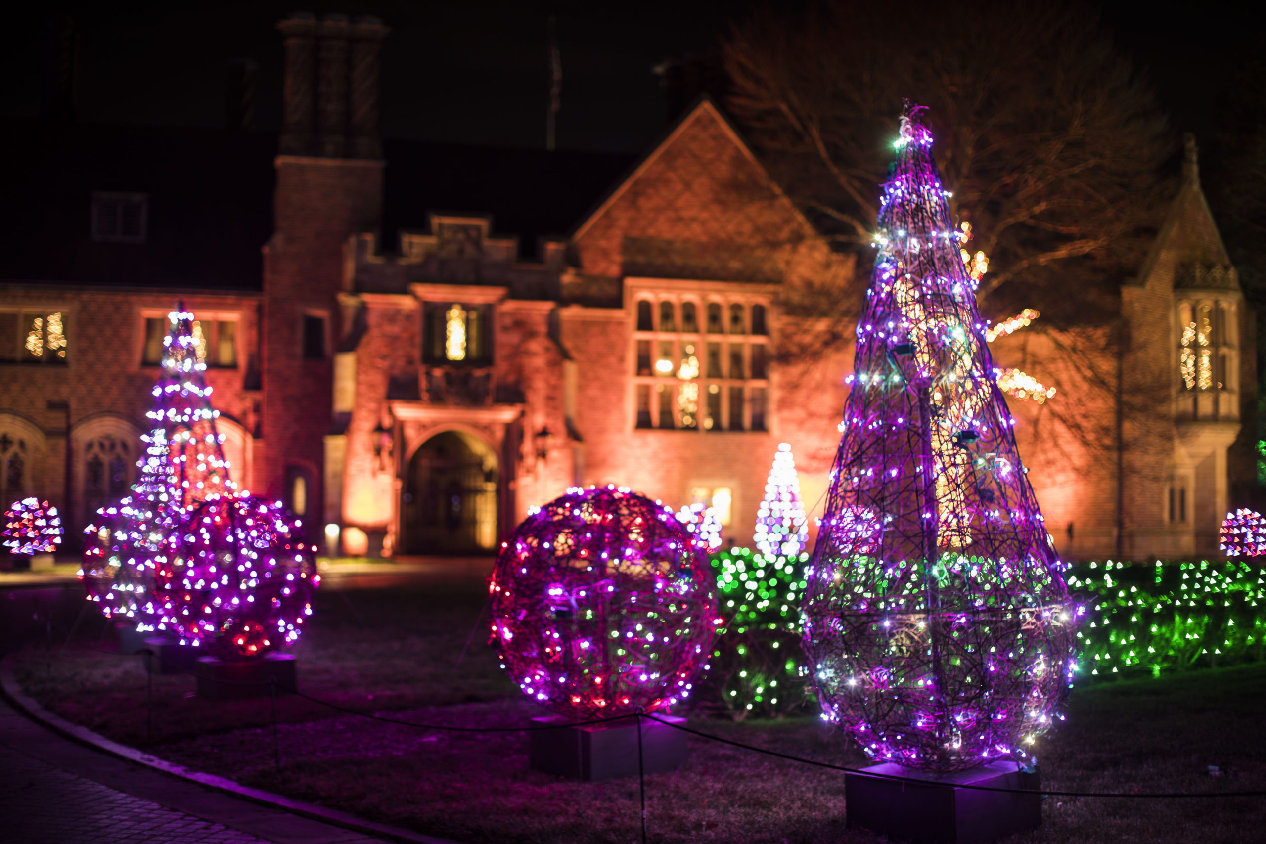 Holiday decorated trees in front of Meadow Brook Hall