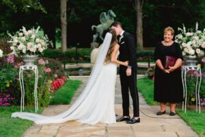 Beautiful wedding in front of the Pegasus Fountain at Meadow Brook Hall in Rochester, Michigan.