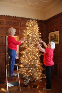 Meadow Brook Volunteers help install decor for the Holidays at Meadow Brook.