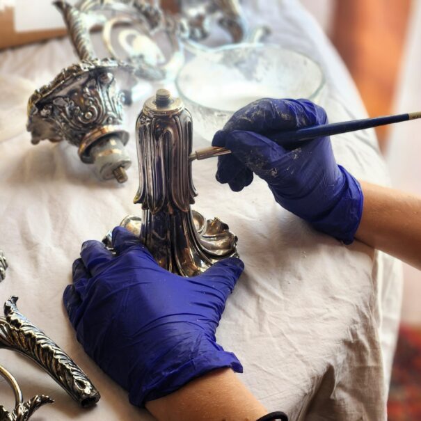 Volunteers at Meadow Brook Hall polish the historic silver.