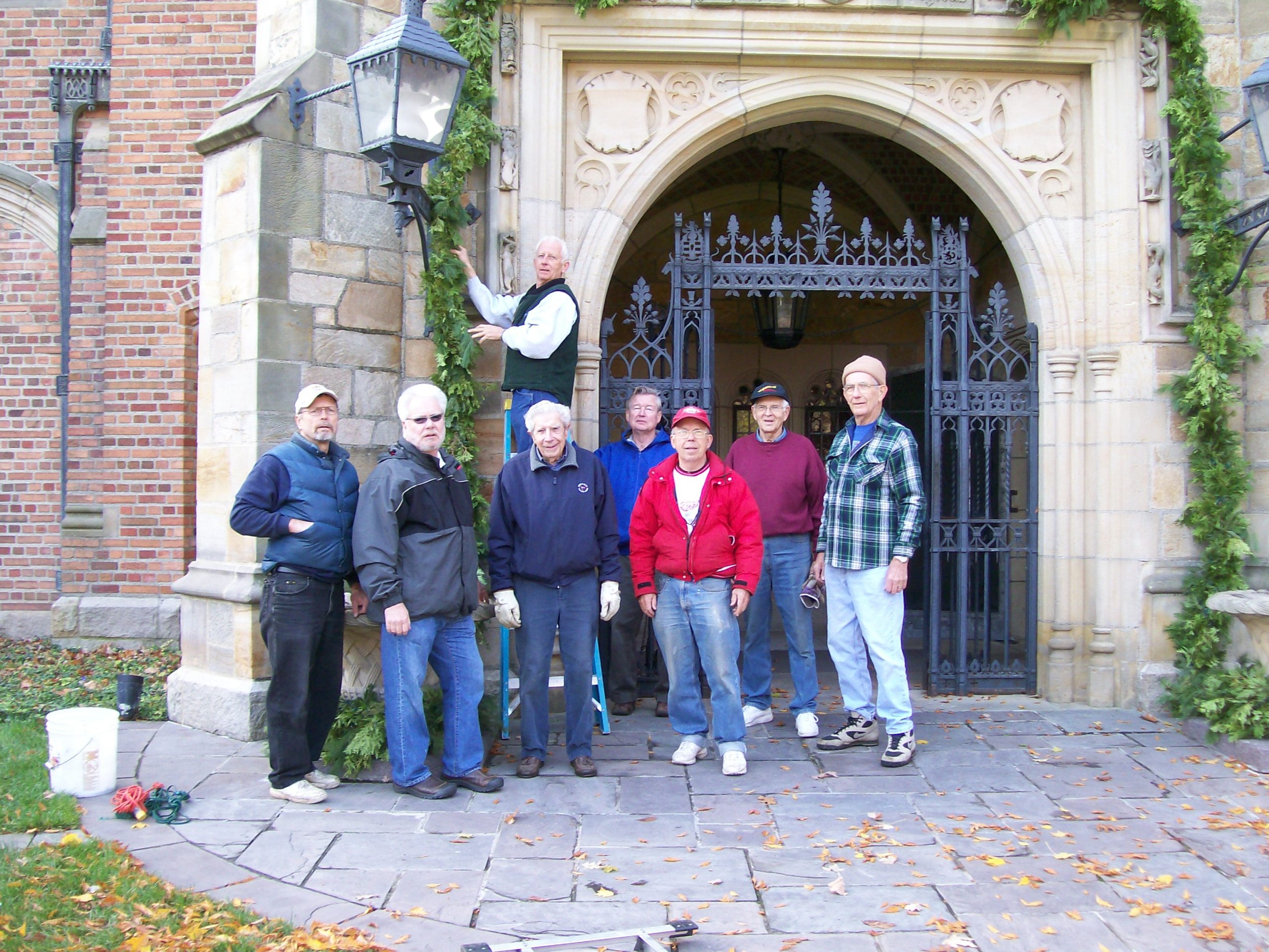 Meadow Brook Volunteers set up holiday walk decor at Meadow Brook