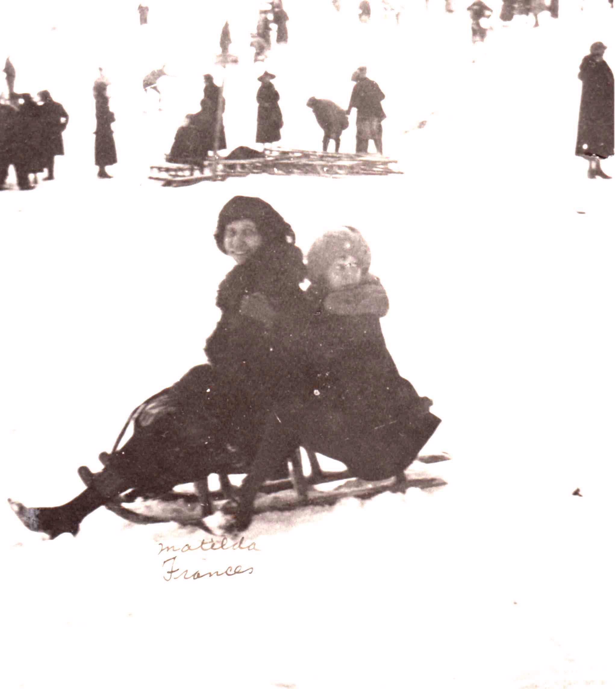 Matilda Dodge Wilson and Frances Dodge sledding in the winter.