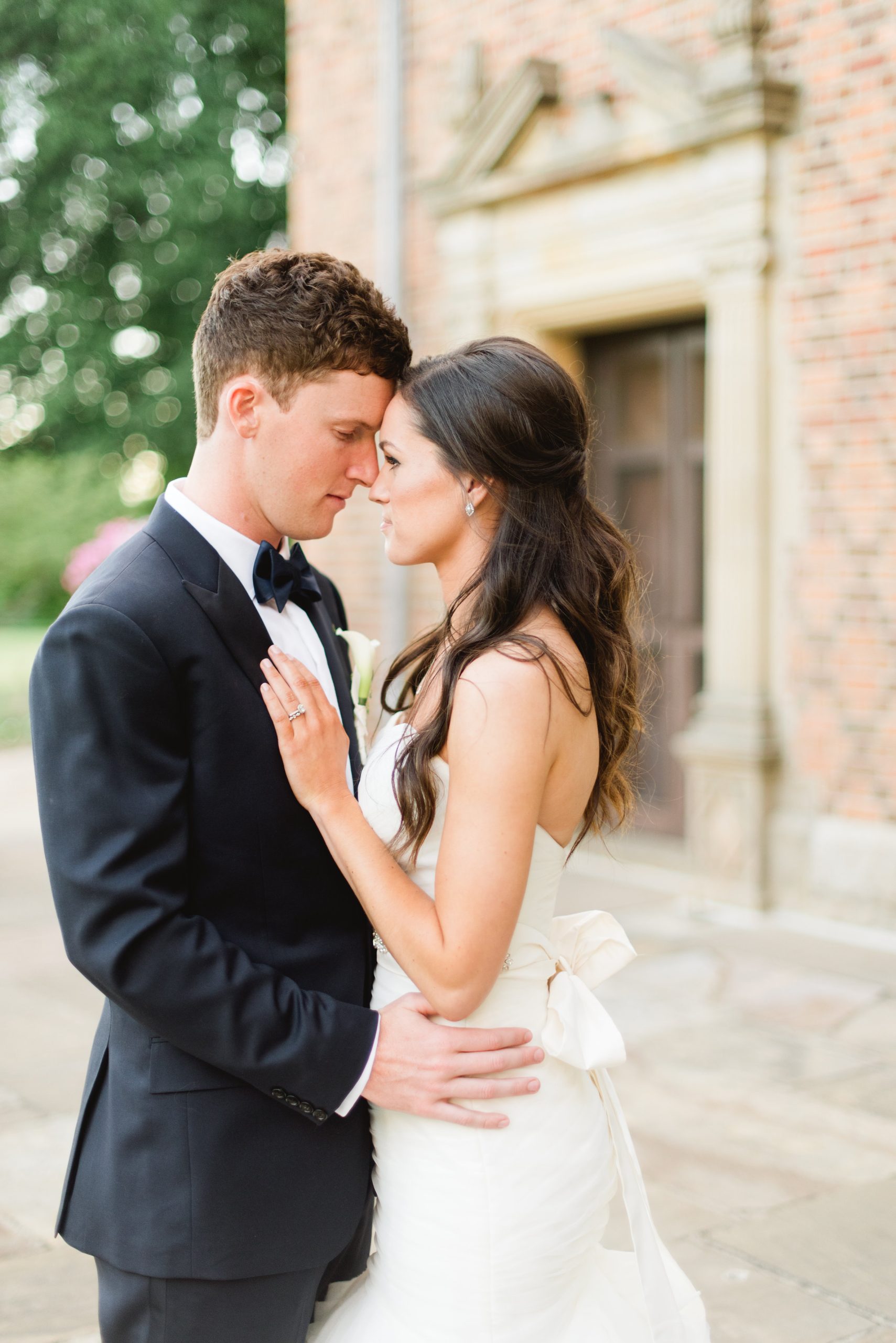 A couple holds each other close on their wedding day at Meadow Brook