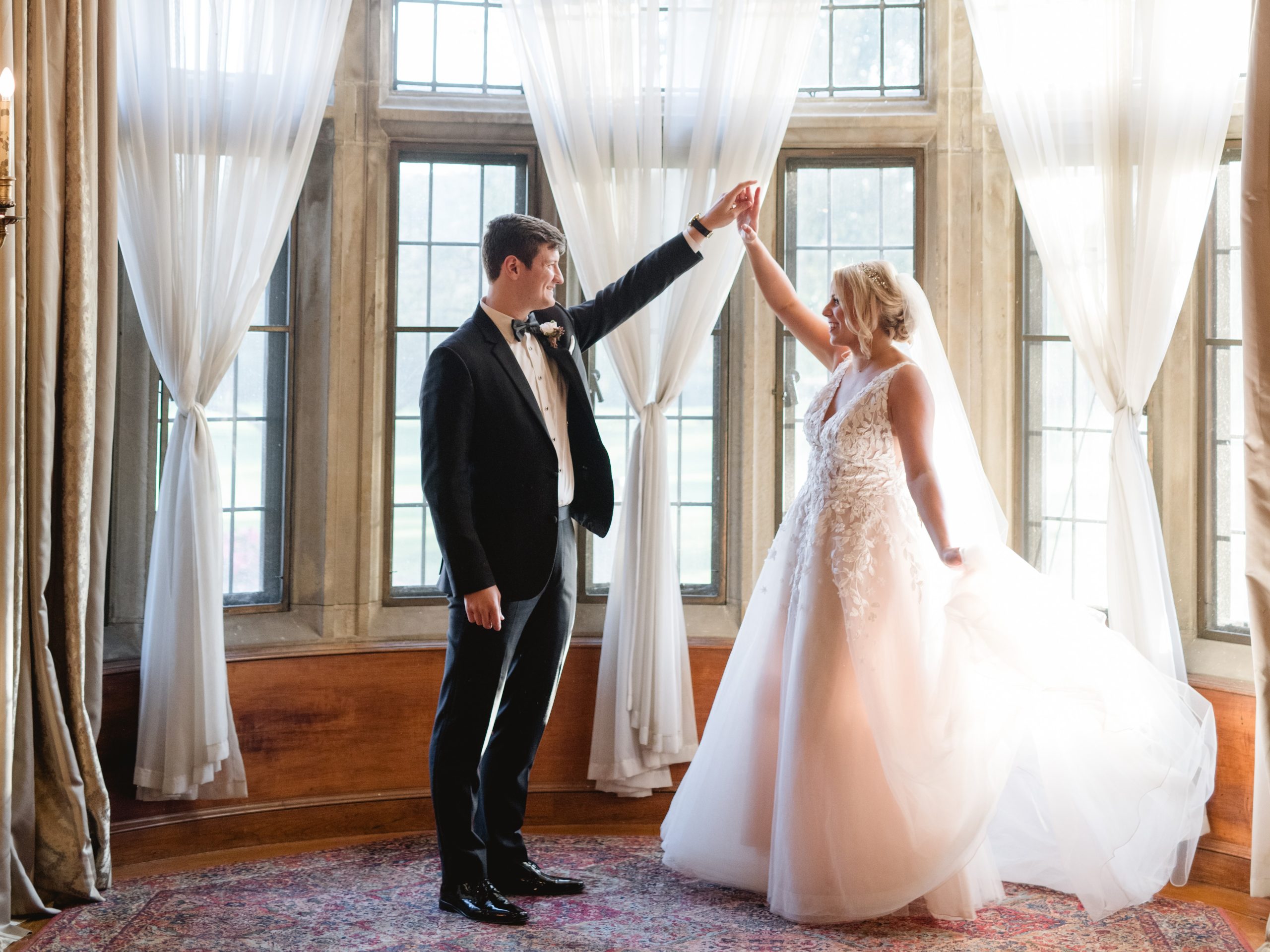 A bride and groom in the Christopher Wren Dining Room at Meadow Brook Hall.