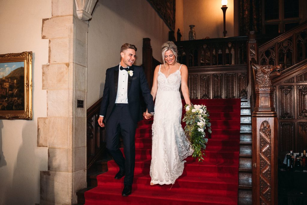 Bride and groom on the Grand Staircase at Meadow Brook on their wedding day