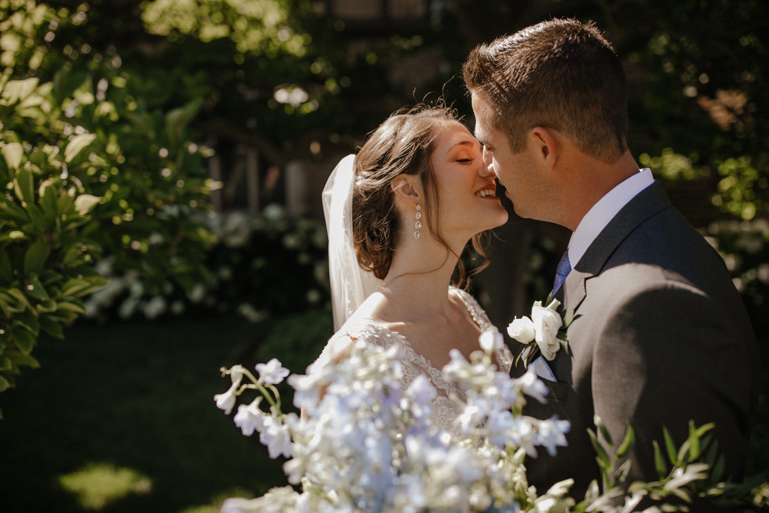 Bride and groom kiss at Meadow Brook Hall