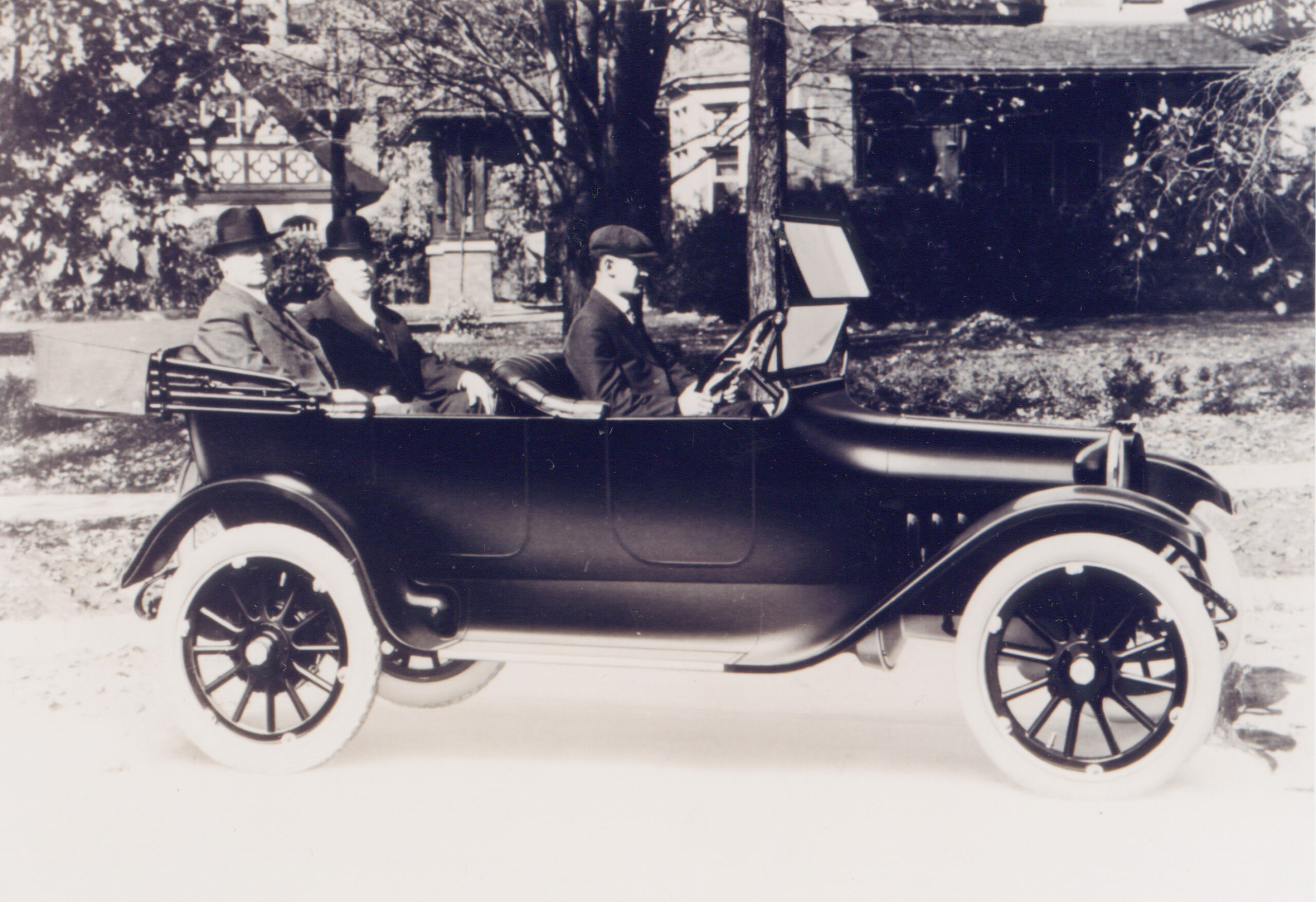 Historic photo of John and Horace Dodge riding in the first Dodge automobile.