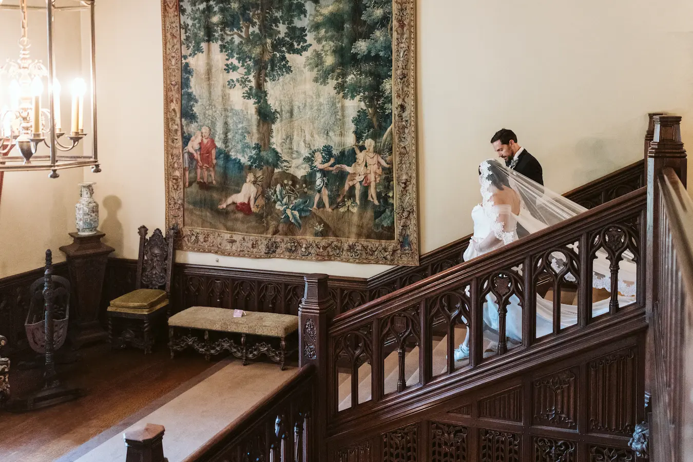 Bride and groom on the Grand Staircase at Meadow Brook on their wedding day